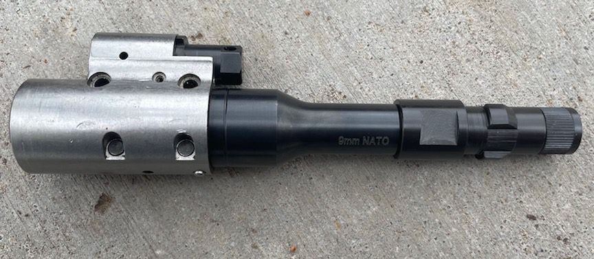 A close up of the barrel on a rifle