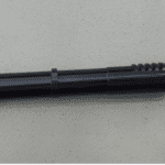 A black pen with a small hole in it.