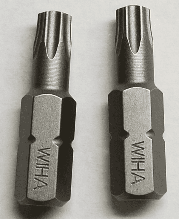 A pair of metal screwdrivers with the word wiha on them.