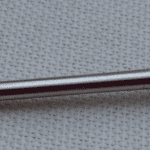 A close up of the end of a metal tube