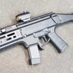 A gun that is laying on the ground.