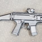 A gun that is sitting on the ground.