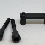 A black handle and two other black handles.