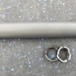 A couple of metal objects laying on the ground.