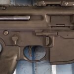 A close up of the trigger and barrel on an ar-1 5