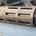 A close up of the barrel on a rifle