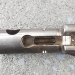 A close up of the inside of an open gun