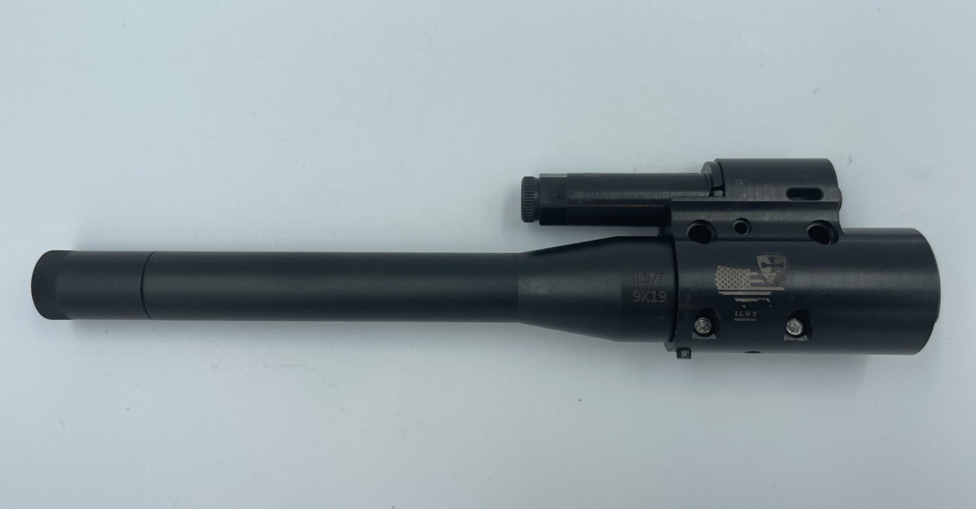 A black rifle with a gun sight and barrel.