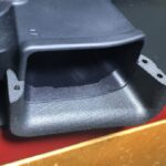 A close up of the bottom of a car