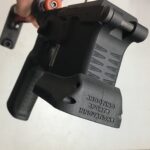A person holding an ar-1 5 magazine.