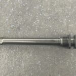 A metal pipe sitting on top of a floor.