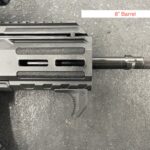 A gun that is sitting on the ground.