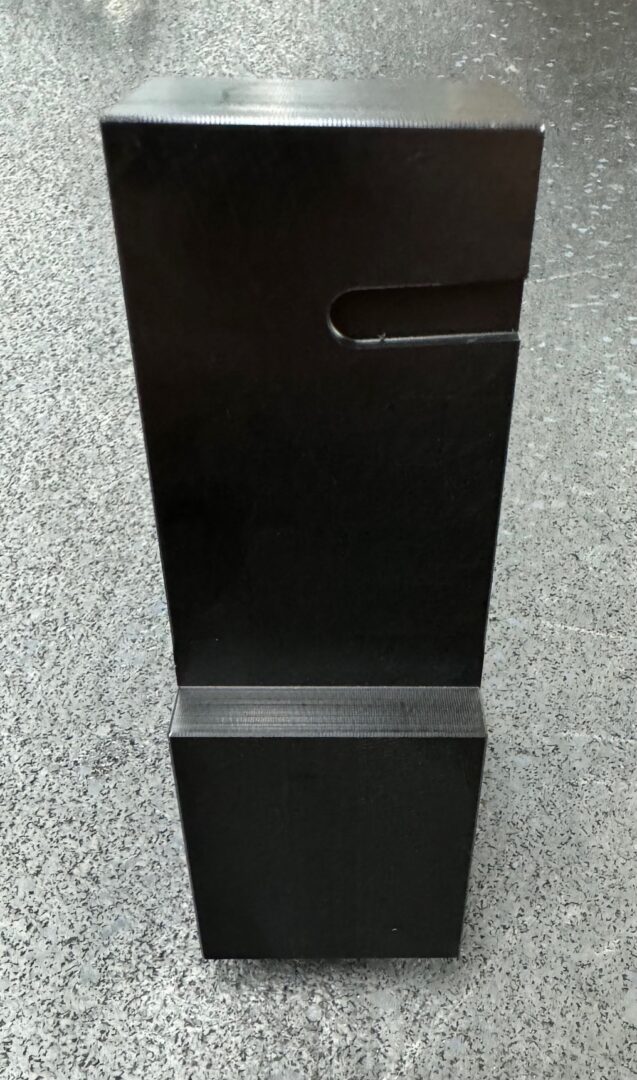 A black box sitting on top of the floor.