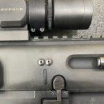 A close up of the sight on a rifle