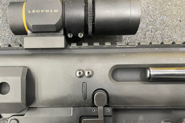 A close up of the sight on a rifle