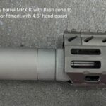 A close up of the barrel and hand guard on a rifle