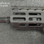 A close up of the barrel and end guard on an ar-1 5