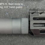 A close up of the barrel and the end of an ar 1 5