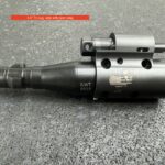 A gun that is sitting on the ground.