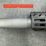 A close up of the barrel on a rifle