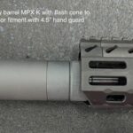 A close up of the barrel and hand guard on a rifle