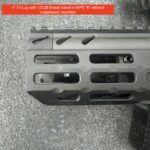 A close up of the bottom of a rifle