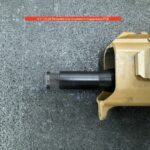 A gun that is sitting on the ground.