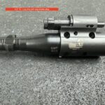 A gun that is sitting on the ground.