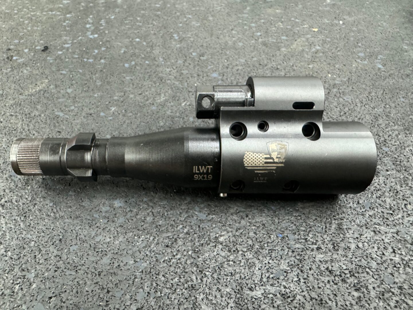 A close up of an air rifle on the ground